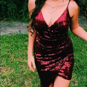 A short on one side long on the other dressy, nice burgundy sequin dress.